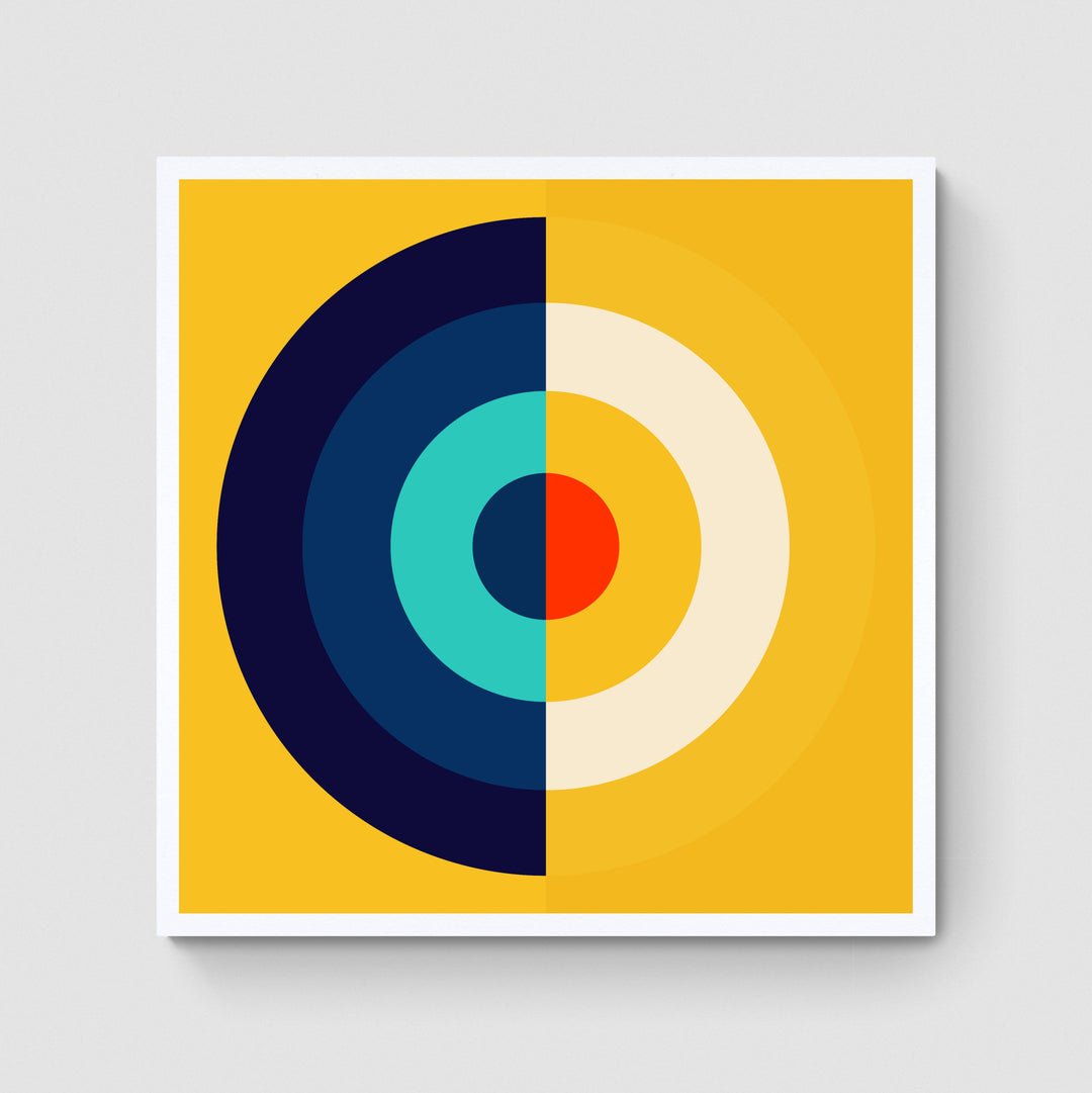 A giclée print of a colorful geometric digtal artwork on a white wall. Abstract circle and semi circular patterns, mainly bright yellow, dark blue, and red colors.