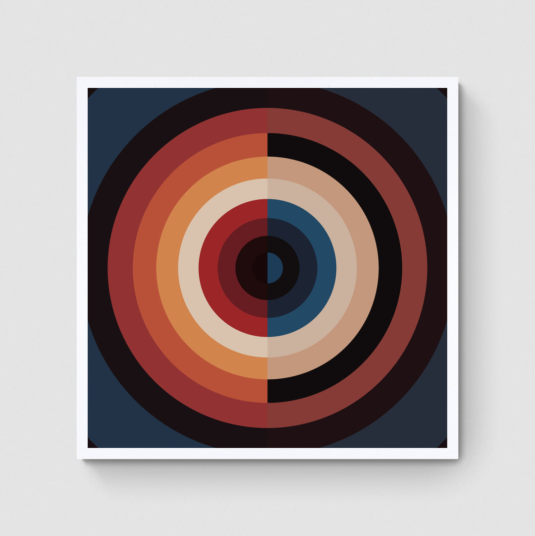 A giclée print of a colorful geometric digtal artwork on a white wall. Abstract circle and semi circular patterns, mainly deep brown, red and blue colors.
